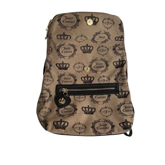 A Juicy Couture tan And Black Medium Backpack With Crown And Key. Fold Over Top
